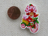 Second view of Strawberry Shortcake Riding a Bike Needle Minder.