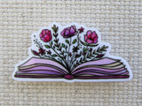 First view of Flowers Exploding from an Open Book Needle Minder.