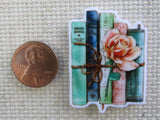 Second view of A Bundle of Blue Books with a Pink Rose Needle Minder.