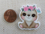Second view of Cute sloth sitting with a pink flower crown minder.