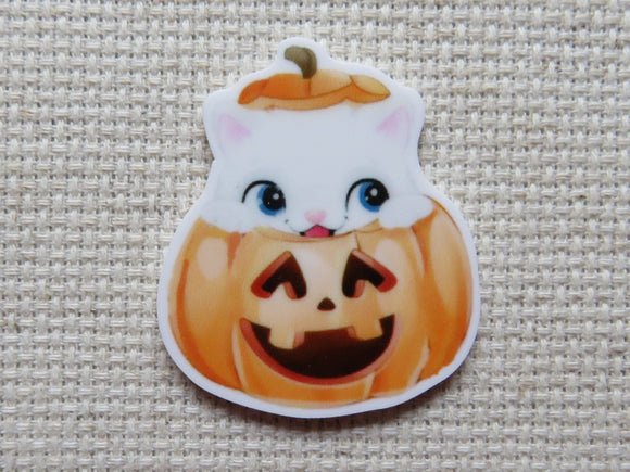 First view of White Kitty Peeking Out of a Jack-O-Lantern Needle Minder.