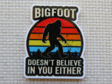 Minder with Bigfoot design and text on a textured background