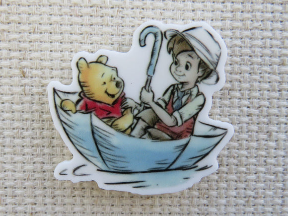 First view of Christopher Robin and Pooh Bear Floating in an Umbrella Needle Minder.