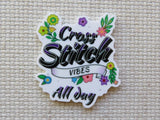 Minder with 'Cross Stitch Vibes All Day' text on a textured fabric background