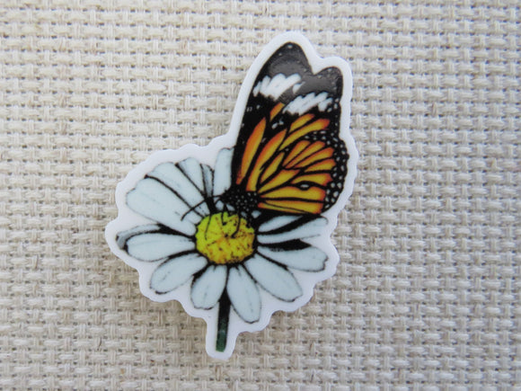 First view of Monarch Butterfly on a White Flower Needle Minder.