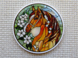 Stained glass-style minder with a horse and floral design on a textured surface