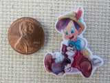 Second view of Pinocchio is Sittng with Figaro Needle Minder.