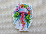 Colorful jellyfish minder with floral elements on a textured beige background