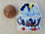 Second view of snowy teacup needle minder.