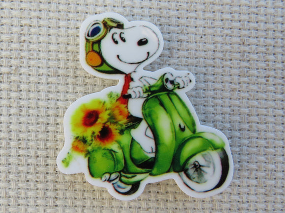 First view of Snoopy on a Green Scooter Needle Minder.
