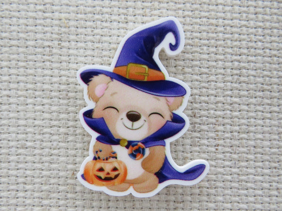 First view of a cute bear dressed as a witch needle minder.