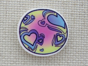 First view of Heart Crater Planet Needle Minder,.