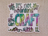 Colorful minder with text 'It's not hoarding if you can craft with it' on a textured background