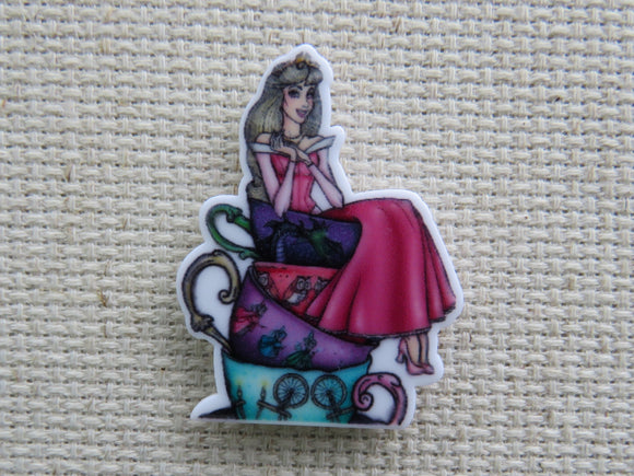 First view of Aurora on a Stack of Teacups Needle Minder.