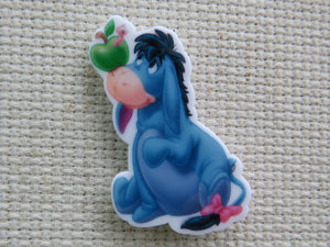 First view of Eeyore is Looking at an Apple on his Nose Needle Minder.