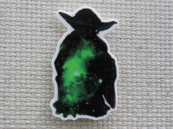 First view of black and green solar system in a Yoda silhouette needle minder.
