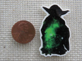 Second view of black and green solar system in a Yoda silhouette needle minder.