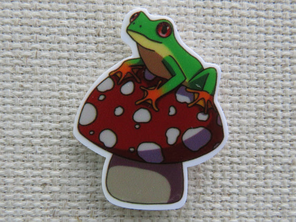 First view of Frog Sitting on a Toadstool Needle Minder.