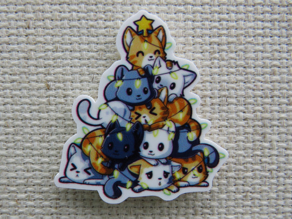 First view of Kittens piled up on each other to form a Christmas tree of cats needle minder.