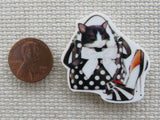 Second view of Adorable kitten in a black and white polka dot purse with a stiletto heeled shoe next to it minder.