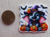 Second view of Happy elephant wearing a witch's hat with jack-o-lanterns and flying bats minder.