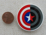 Second view of Two colored Captain America Shield Needle Minder.