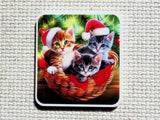 First view of three Christmas cats in a basket minder.