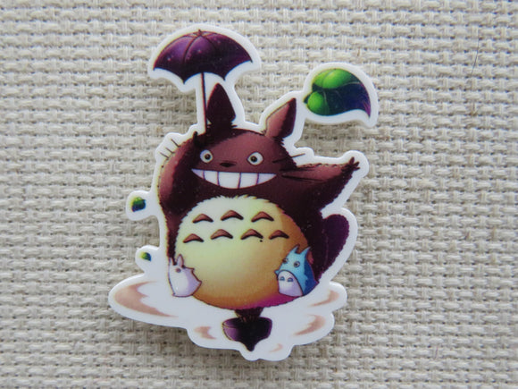 First view of Totoro with a purple umbrella minder.