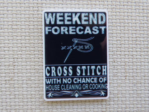 First view of Weekend Forecast Cross Stitch with no Chance of House Cleaning or Cooking in Dark Blue Needle Minder.