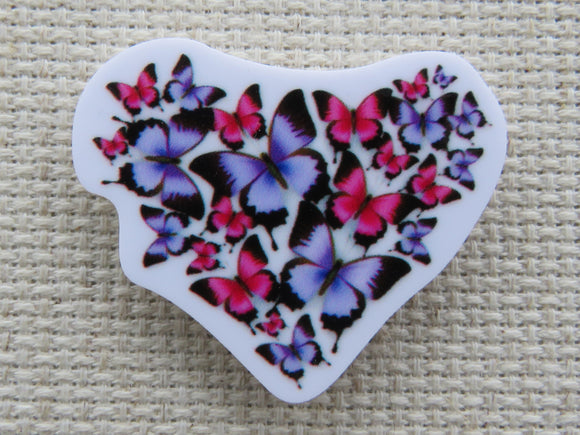 First view of Pink and blue butterflies form into a shape of a heart..