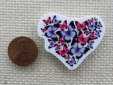 Second view of Pink and blue butterflies form into a shape of a heart..