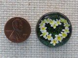 Second view of Plumeria Heart Domed Needle Minder.