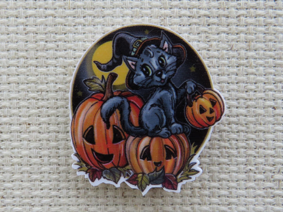 First view of Black Cat Sitting on Carved Pumpkins Needle Minder.