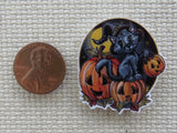 Second view of Black Cat Sitting on Carved Pumpkins Needle Minder.