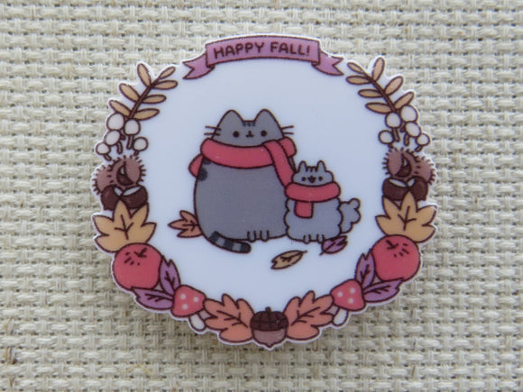 First view of A pair of cartoon cats in a festive Autumn wreath minder.
