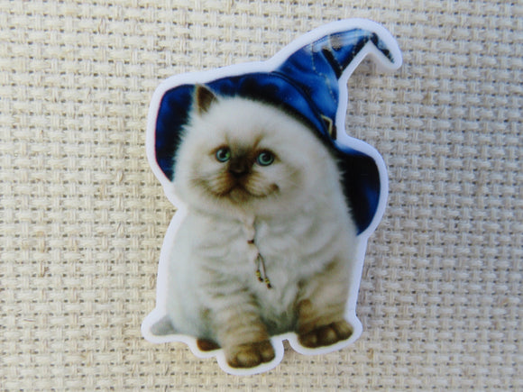 First view of White Kitty with a Witch's Hat Needle Minder.