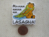 Second view of Garfield is enjoying a pan of lasagna with the words Mmmmmmmmmmm....Lasagna! minder.