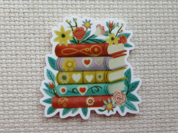 Minder with books and flowers.