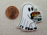Second  view of a ghost carrying a stack of books with a drink on top minder.