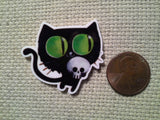 Second view of the Green Eyed Black cat Carrying a Skull Needle Minder