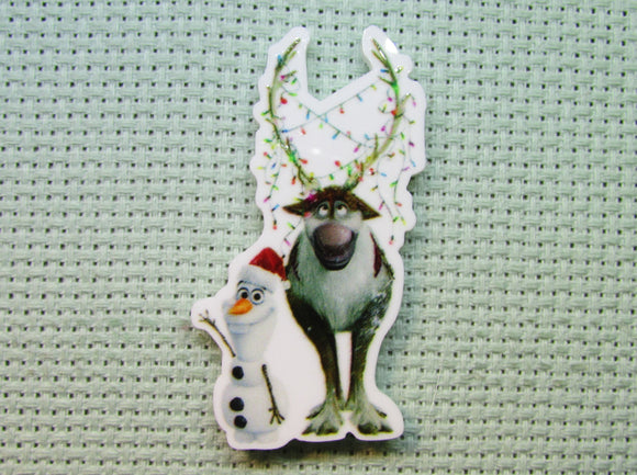 First view of the Olaf and Sven Decorated in Christmas Lights Needle Minder