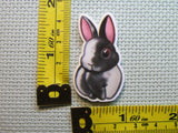 Third view of the Black and White Bunny Needle Minder