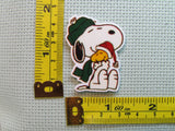 Third view of the Snoopy and Woodstock Christmas Hug Needle Minder