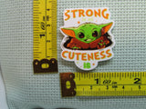 Third view of strong is my cuteness is alien child needle minder.