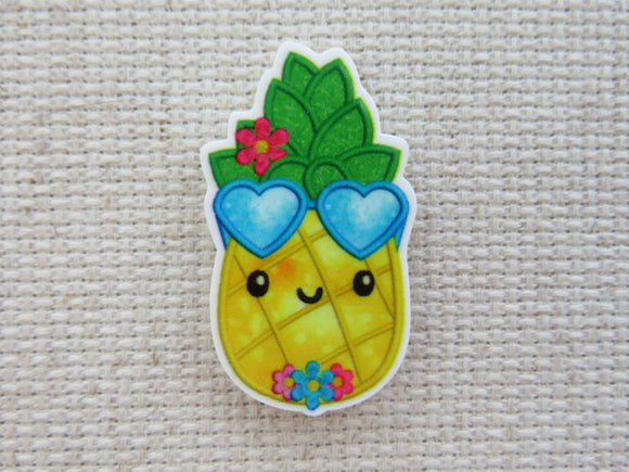 First view of Pineapple with Blue Heart Shades Needle Minder.