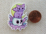 Second view of Purple Bat Cat Sitting on a Skull Needle Minder.
