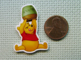 Second view of the Pooh Trying to Get the Last Drop Of Honey out of the Honey Pot Needle Minder