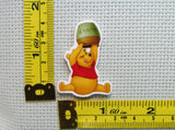 Third view of the Pooh Trying to Get the Last Drop Of Honey out of the Honey Pot Needle Minder