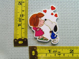 Third view of the Peppermint Patty Getting a Snoopy Kiss Needle Minder