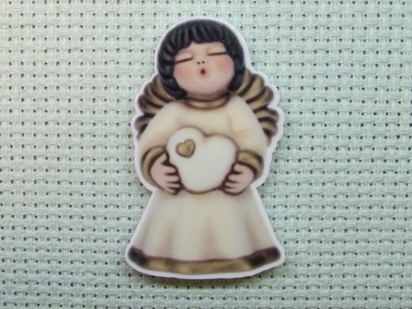 First view of the Angel Holding a Double Heart Needle Minder